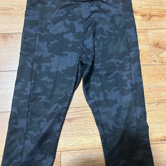 Black Camouflage mid length leggings/ athletic capris. Has pockets. - Picture 2 of 4